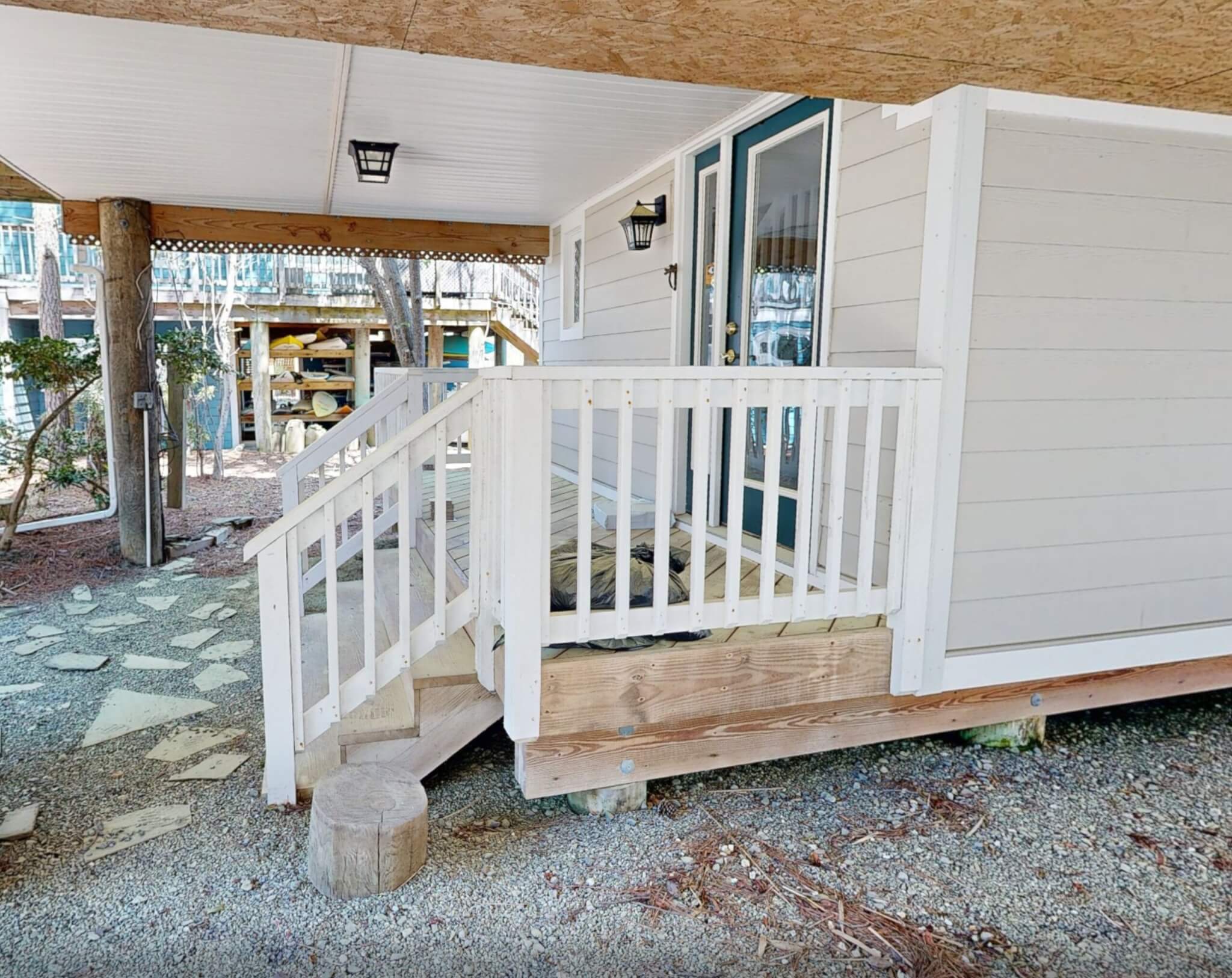 Deck Renovation in Campbell Place, Bethany Beach DE - Table with Six Wooden Chairs and Stainless Steel Grill