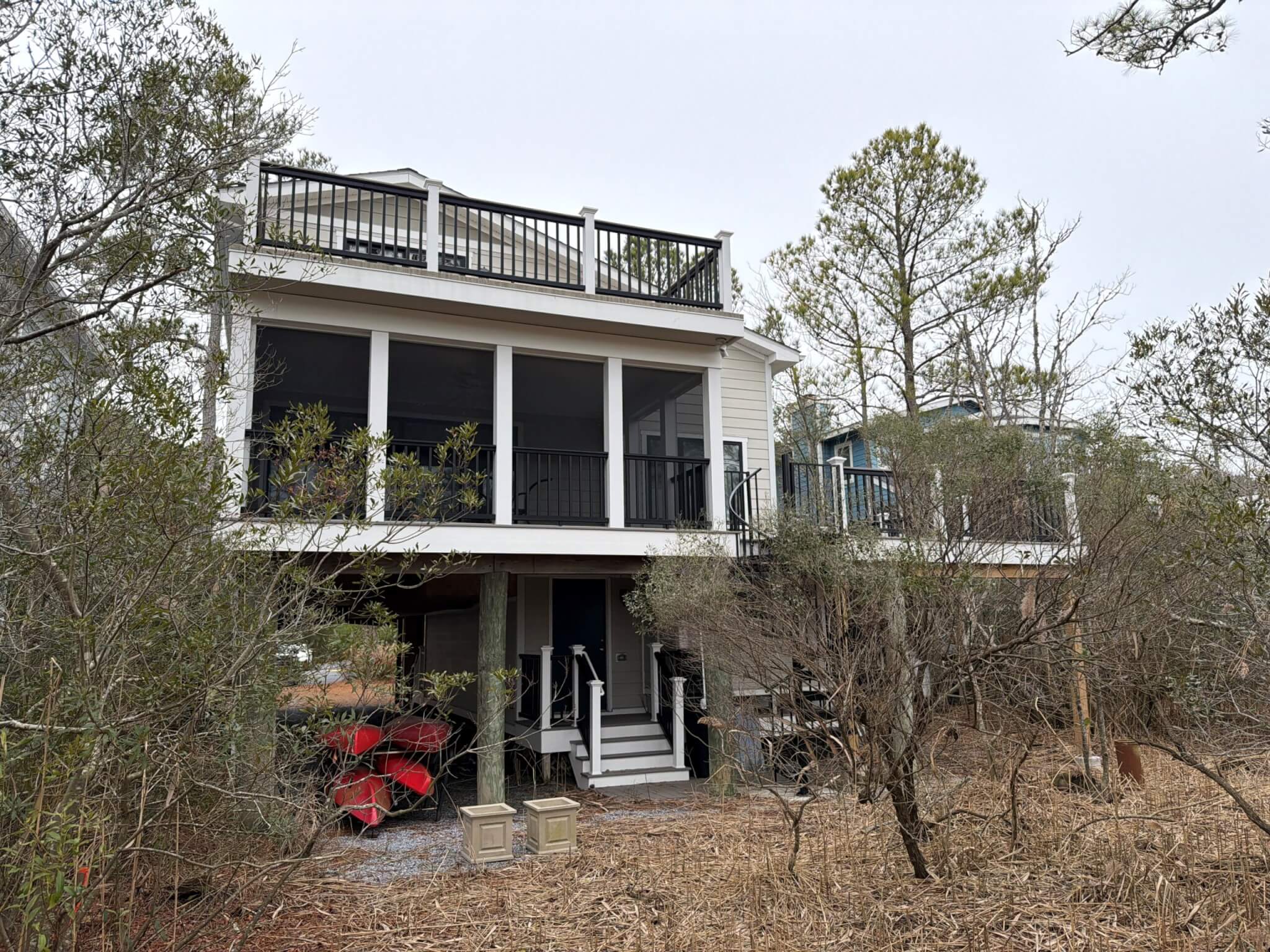 Kent Sunroom Renovation in Bethany Beach DE with White Windows Trip and Dark Wood Bench Seat