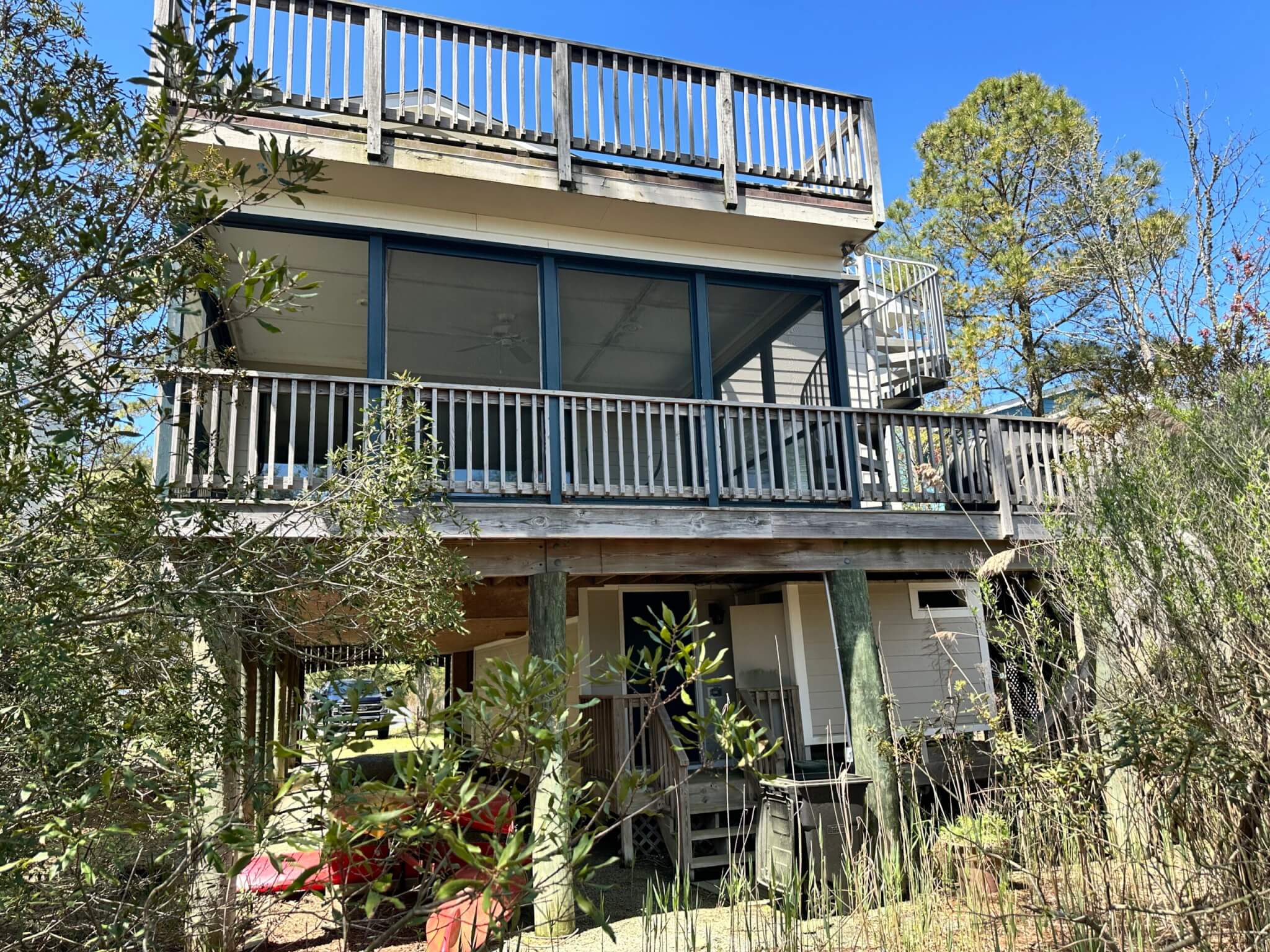 Deck Renovation in Campbell Place, Bethany Beach DE - Table with Six Wooden Chairs and Stainless Steel Grill