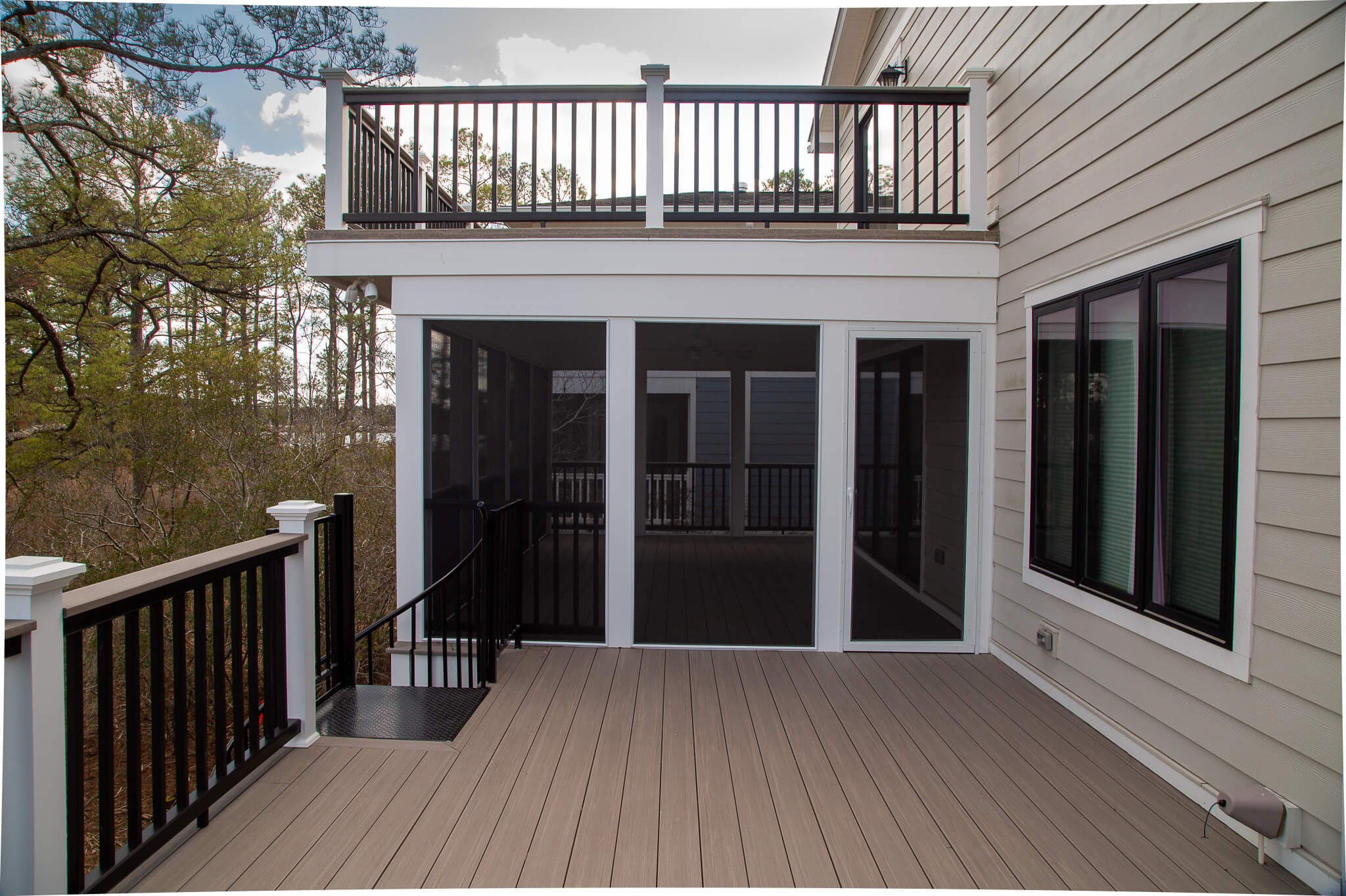 Deck Renovation in Campbell Place, Bethany Beach DE - Table with Six Wooden Chairs and Stainless Steel Grill