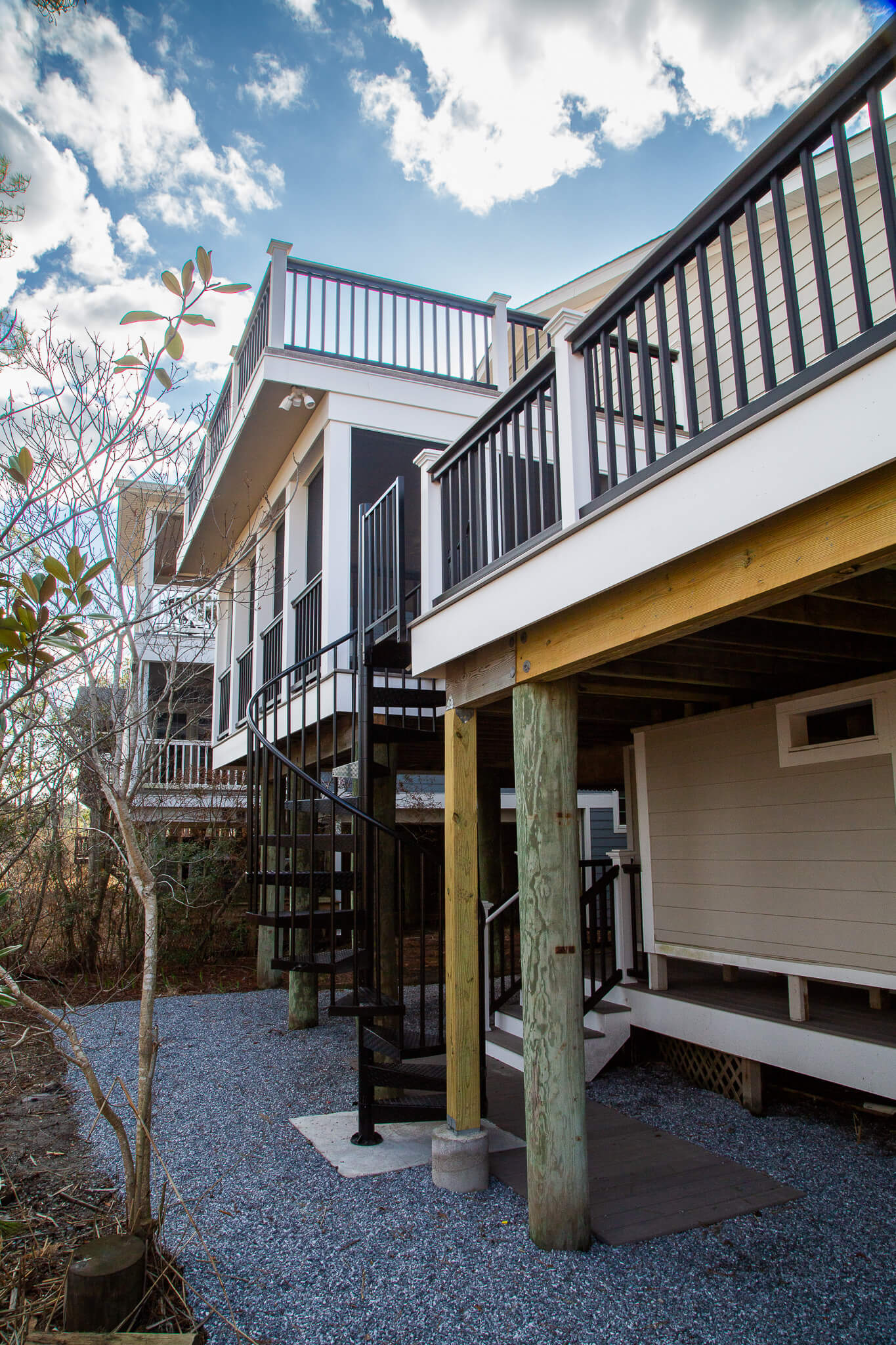 Deck Renovation in Campbell Place, Bethany Beach DE - Table with Six Wooden Chairs and Stainless Steel Grill