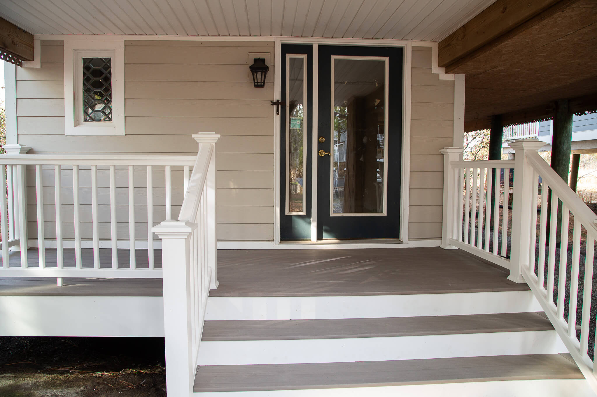 Deck Renovation in Campbell Place, Bethany Beach DE - Table with Six Wooden Chairs and Stainless Steel Grill