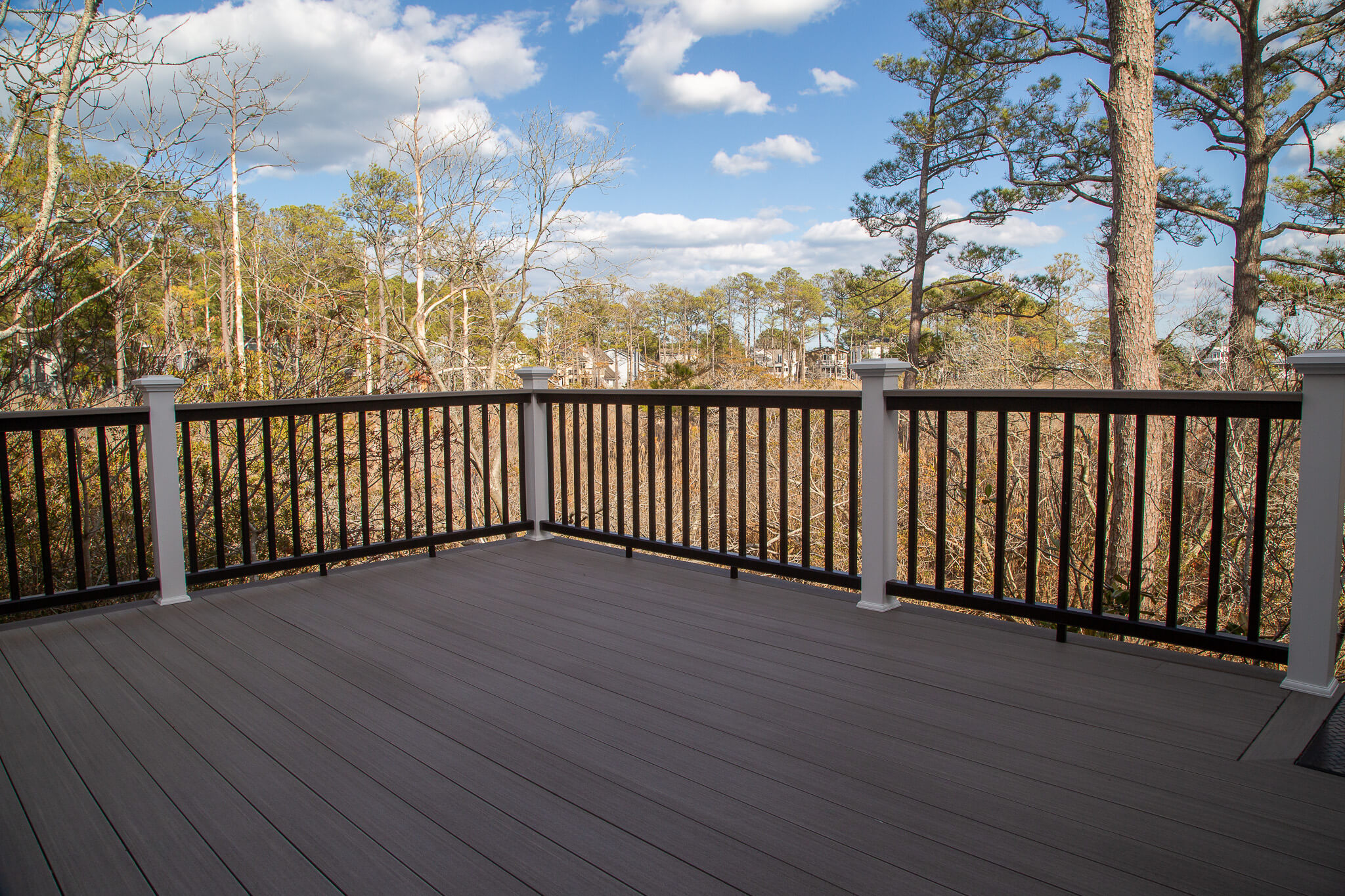 Deck Renovation in Campbell Place, Bethany Beach DE - Table with Six Wooden Chairs and Stainless Steel Grill