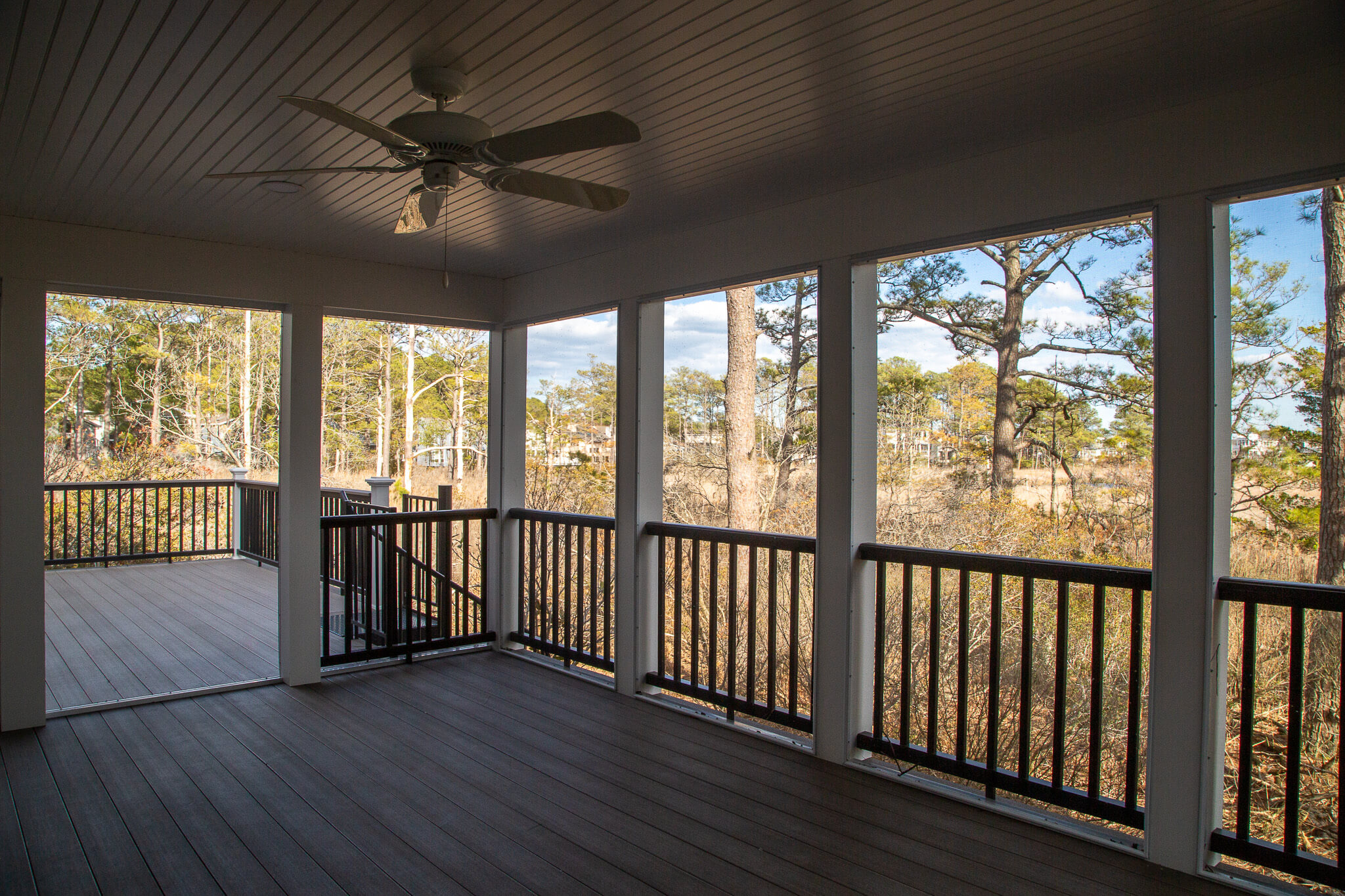 Kent Sunroom Renovation in Bethany Beach DE with White Windows Trip and Dark Wood Bench Seat