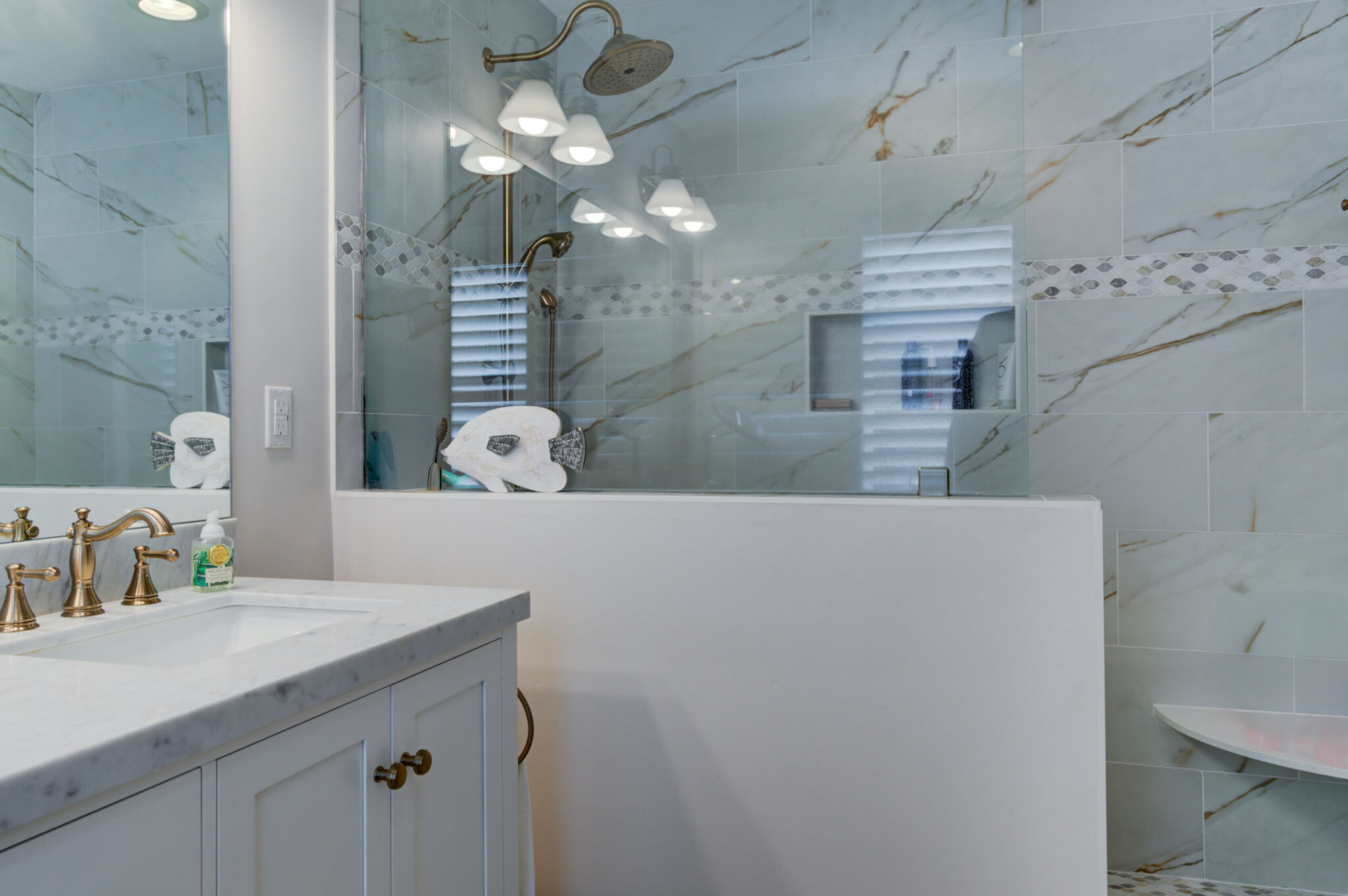 Bathroom Remodel in Bethany Lakes, Bethany Beach DE with White Vanity, Tub, Arpell Azul Mosaic Wall Tiles, Snape Gloss Tiles