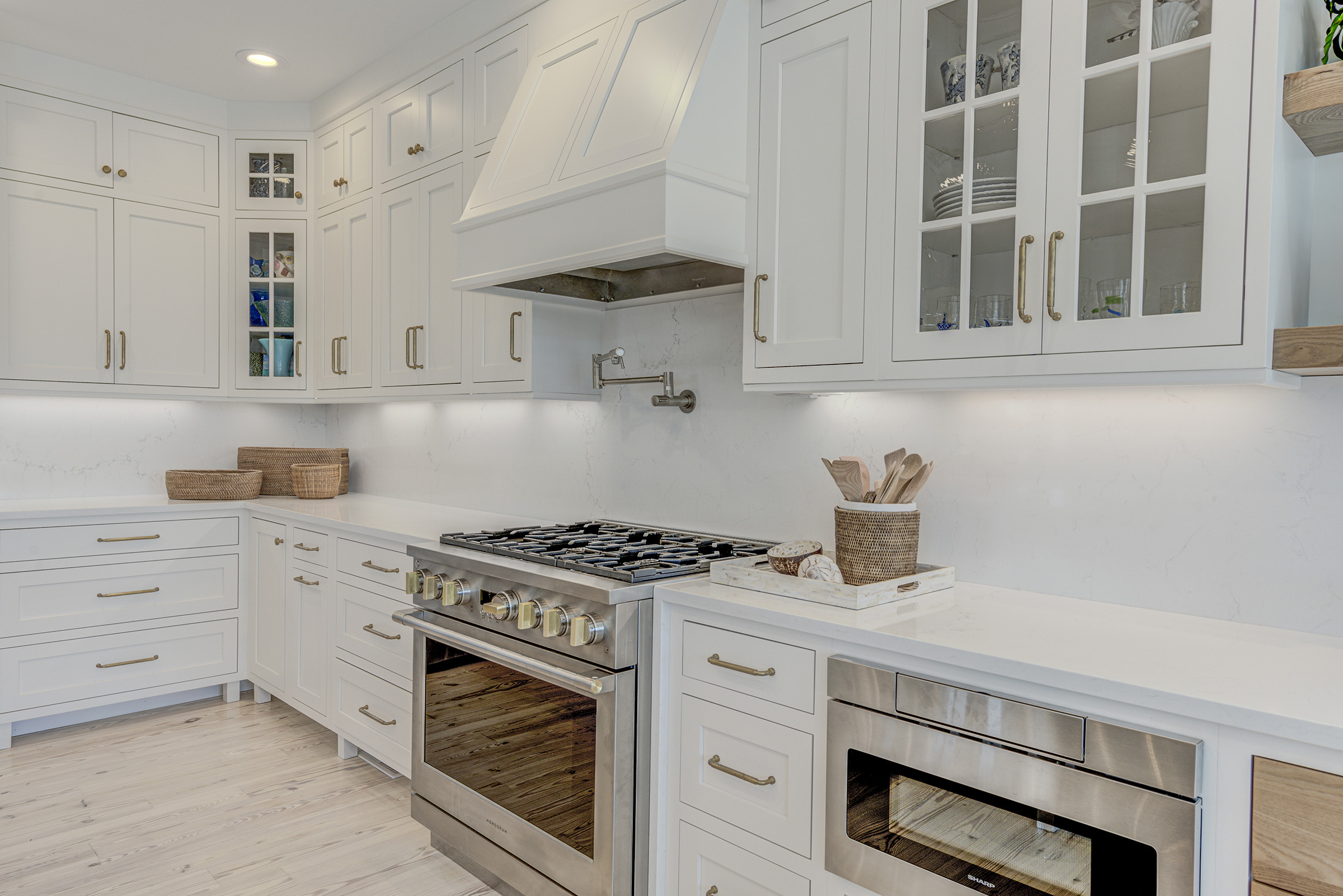 Sea Light Design-Build Pine Road Kitchen Renovation in Selbyville Delaware - under counter microwave allows for more work space on counter