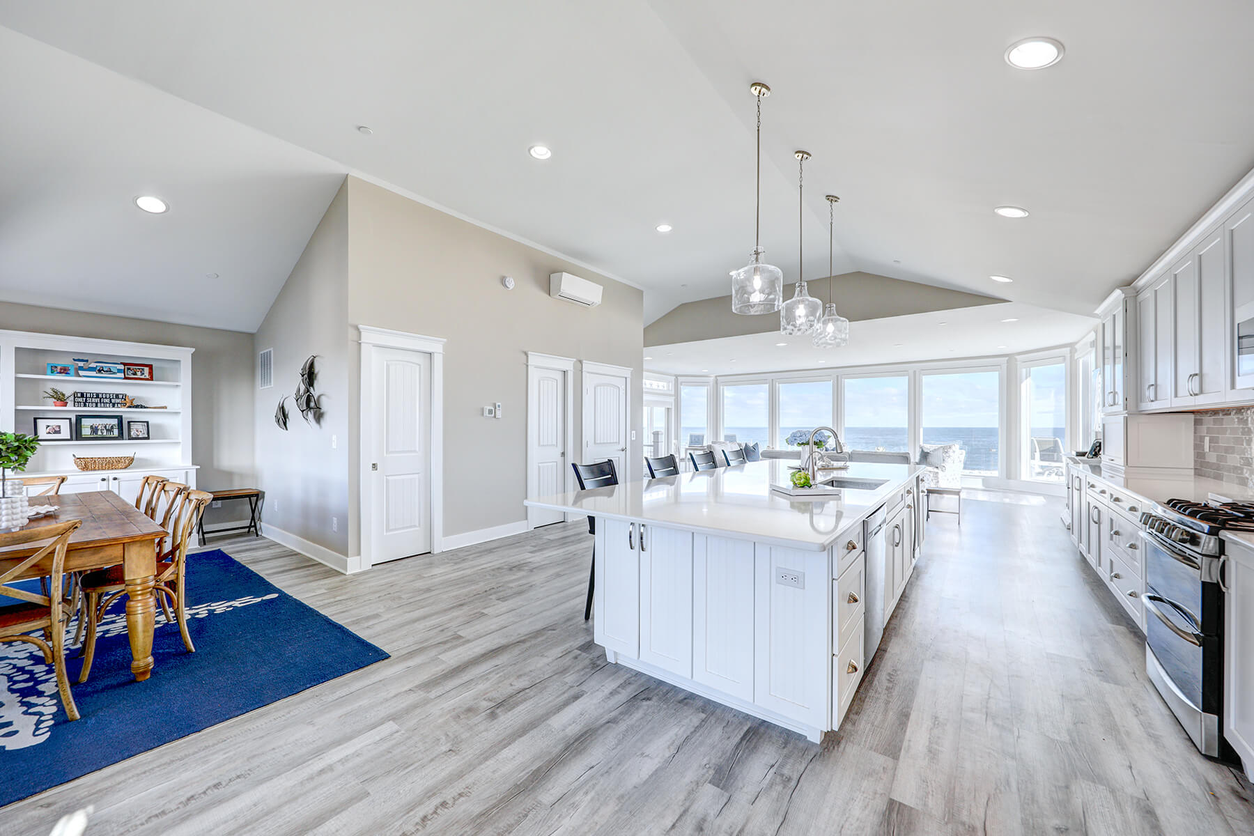 Deck Renovation in Campbell Place, Bethany Beach DE - Table with Six Wooden Chairs and Stainless Steel Grill