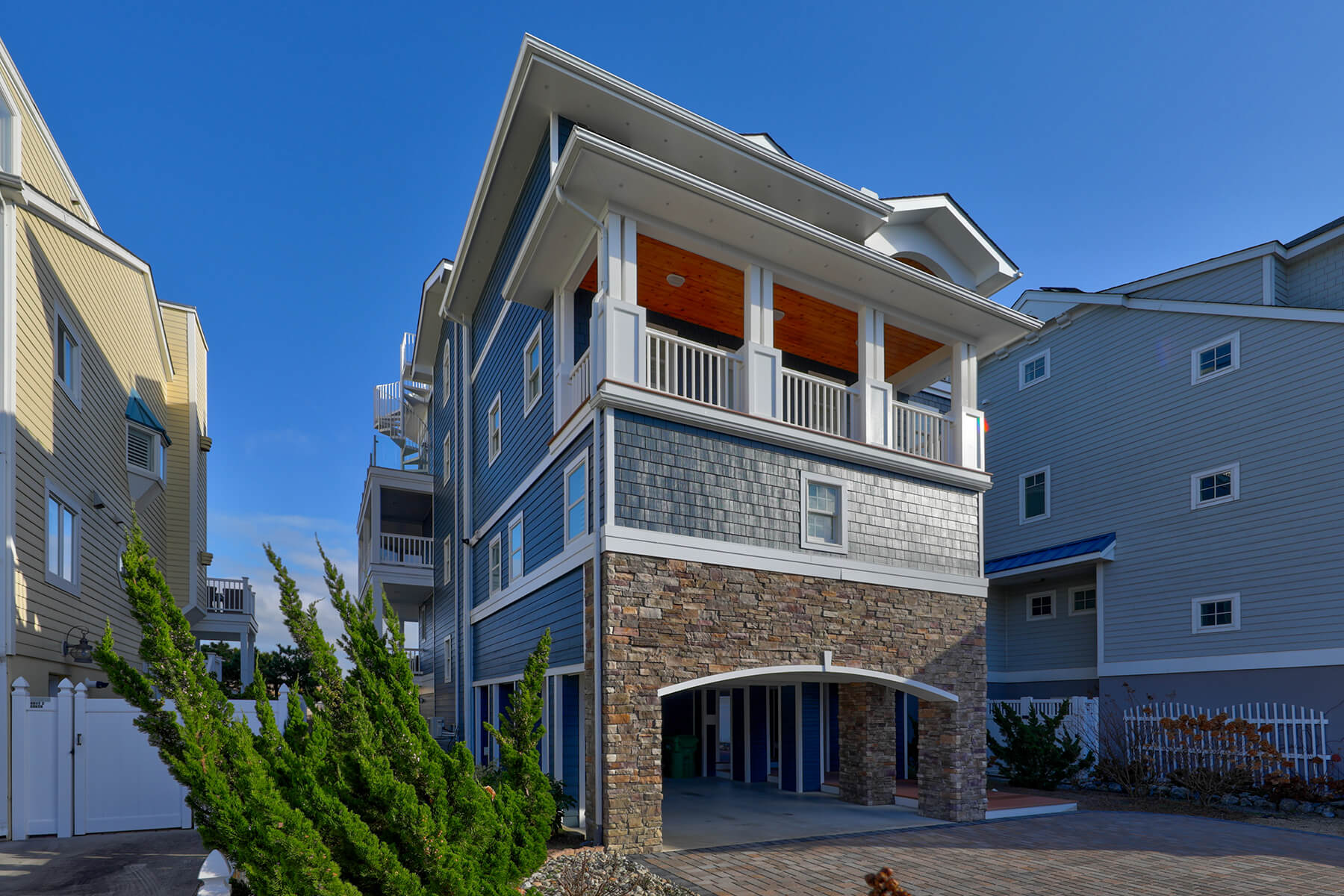 Deck Renovation in Campbell Place, Bethany Beach DE - Table with Six Wooden Chairs and Stainless Steel Grill