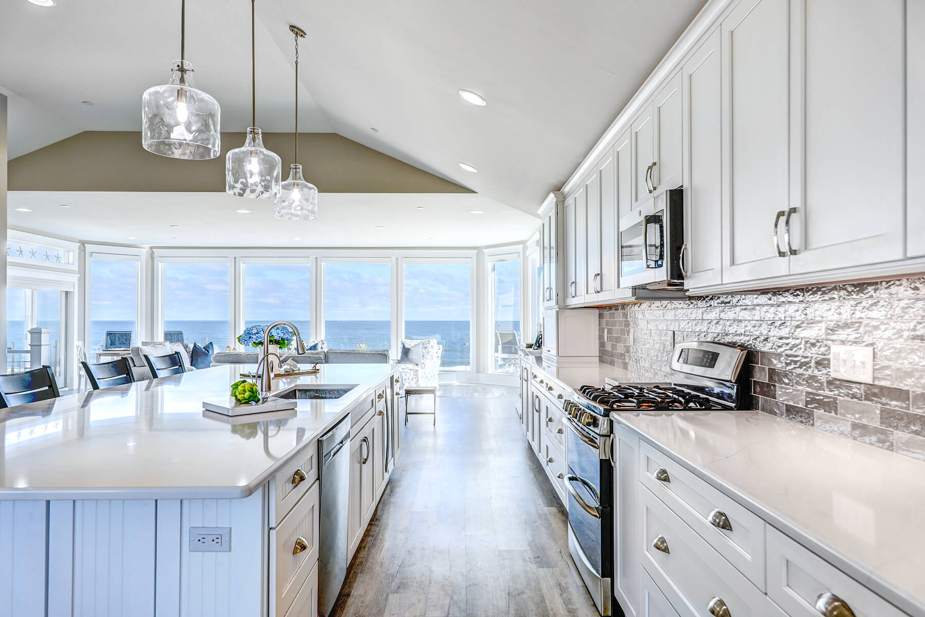 Deck Renovation in Campbell Place, Bethany Beach DE - Table with Six Wooden Chairs and Stainless Steel Grill