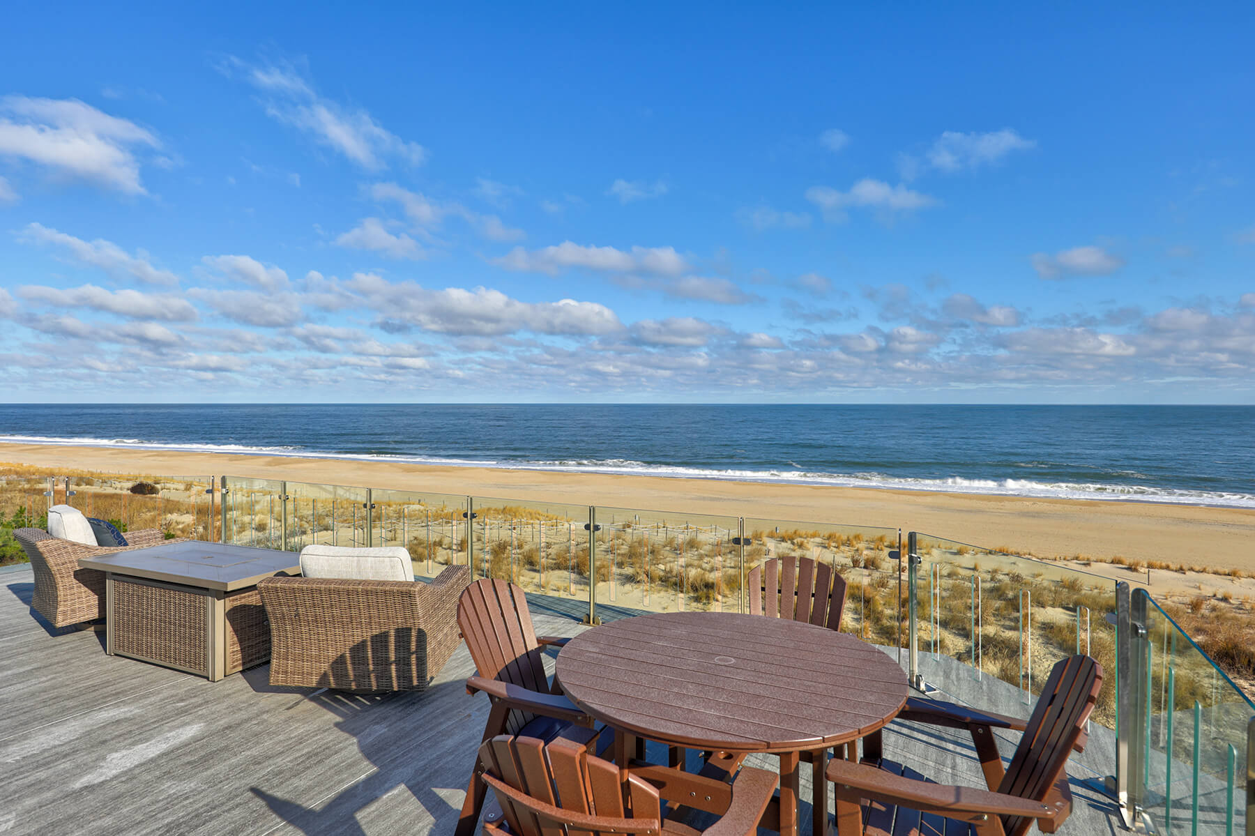 Deck Renovation in Campbell Place, Bethany Beach DE - Table with Six Wooden Chairs and Stainless Steel Grill