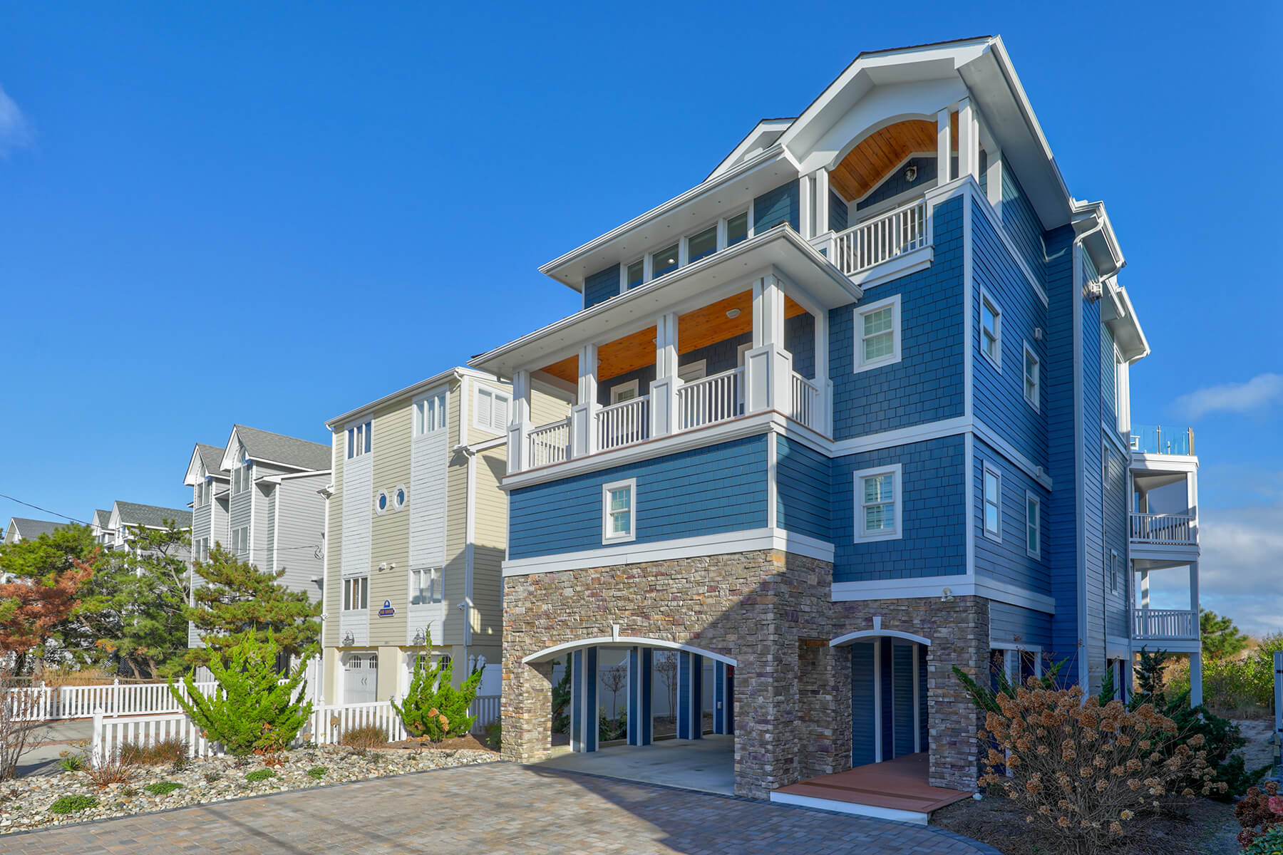 Deck Renovation in Campbell Place, Bethany Beach DE - Table with Six Wooden Chairs and Stainless Steel Grill