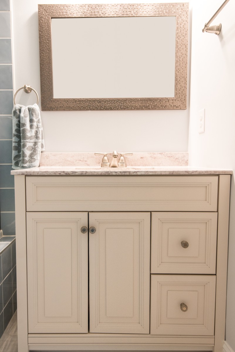 Bethany Lakes Renovation Bethany Beach, DE Bathroom with White Vanity, Granite Top and Metallic Frame Mirror