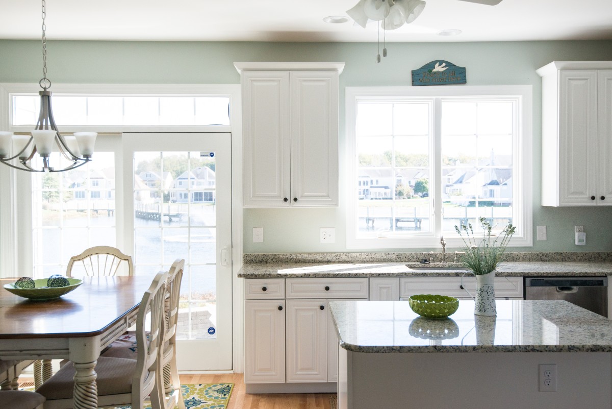 Bethany Lakes Renovation Bethany Beach, DE Cozy Kitchen with Ornament Pendant Light, Large Windows and Glass Door