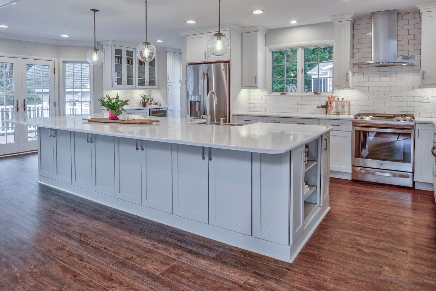 Canal Way Kitchen Remodel in Bethany Beach DE with Center Island and Dark Wood Flooring
