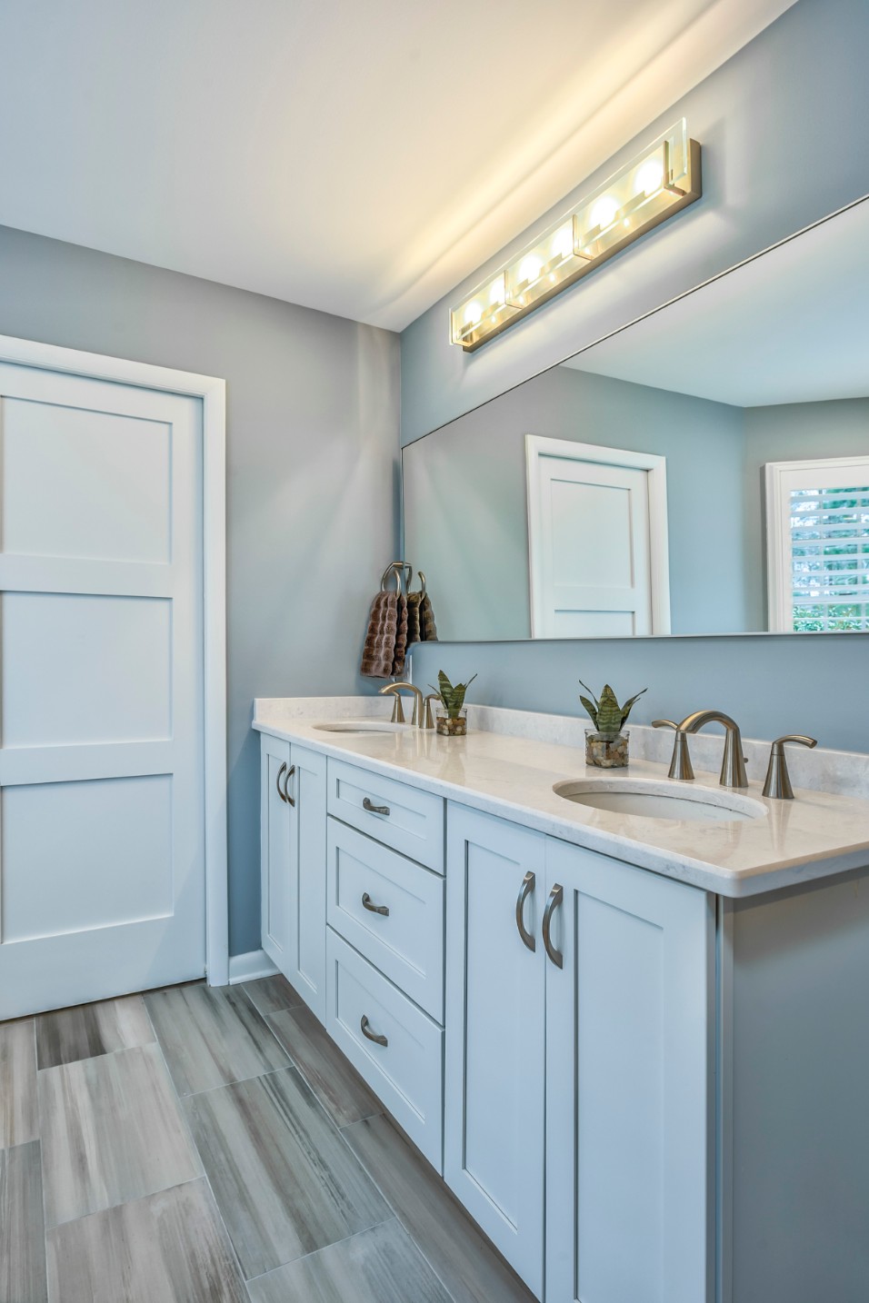 Canal Way Renovation in Bethany Beach DE - Bathroom with Large Frameless Mirror and Two Sinks