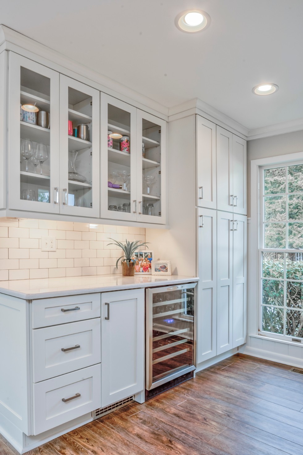 Canal Way Renovation in Bethany Beach DE - Kitchen with Wine Cooler and White Subway Tile Backsplash