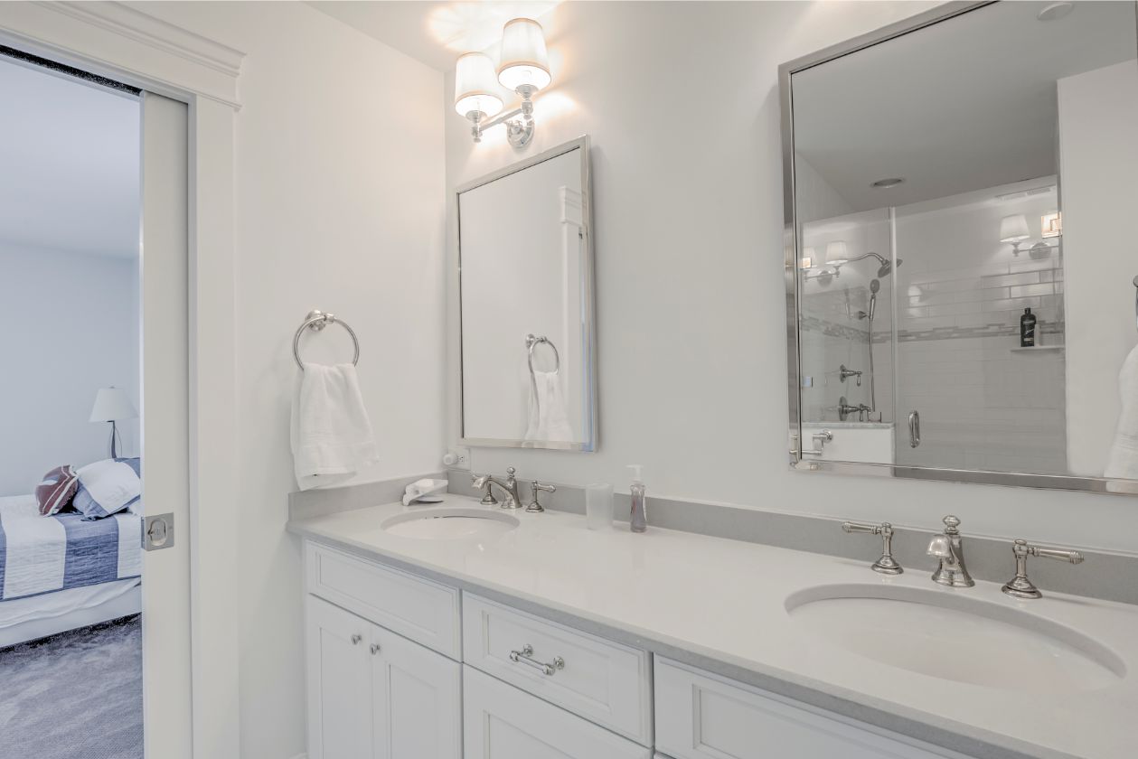 Bathroom Remodel in Dune Road, Bethany Beach DE - Master Bathroom with White Vanities, White Top and Two Mirrors