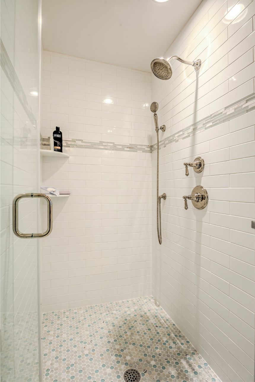 Shower with White Subway Wall Tiles and Mosaic Floor
