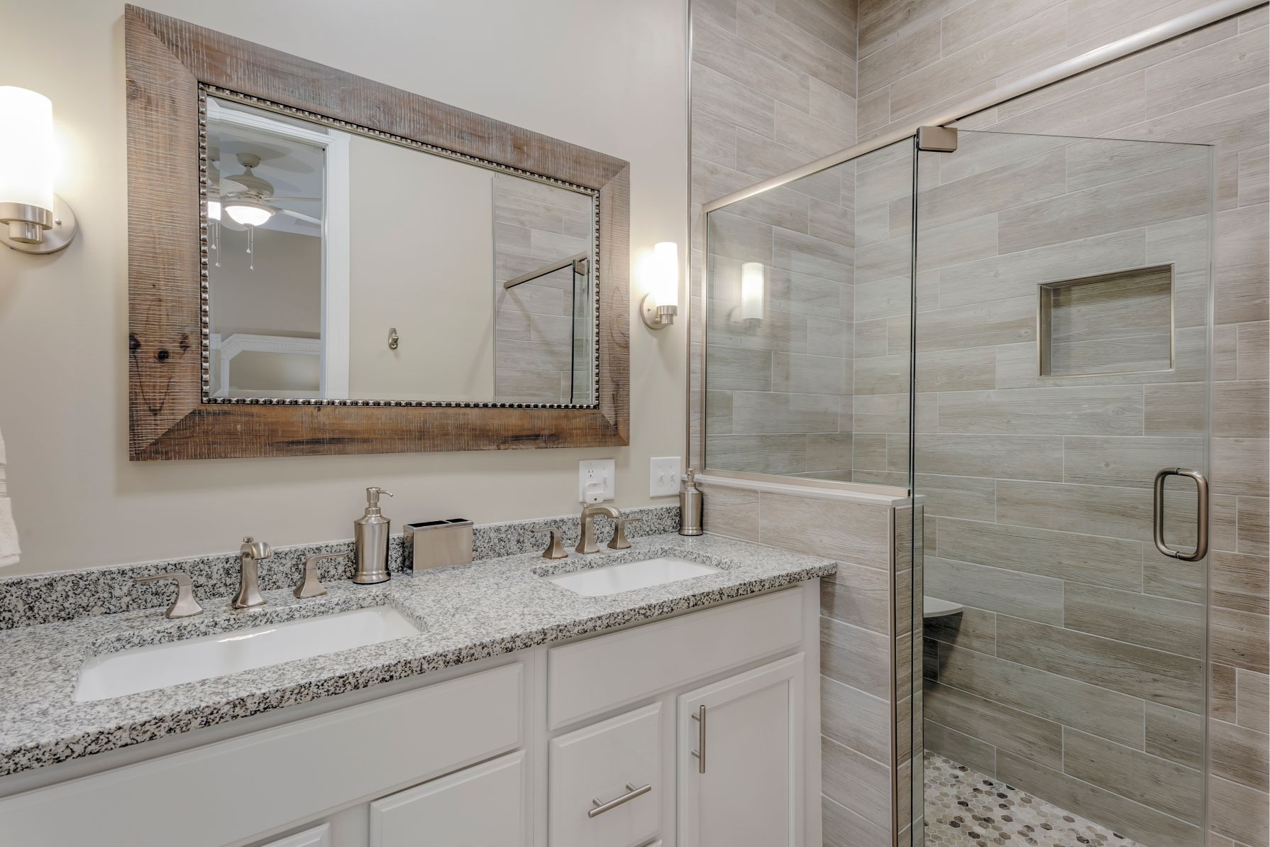 Addition in Juniper Court, Ocean Pines MD - Bathroom with White Vanities and Frameless Glass Shower Door