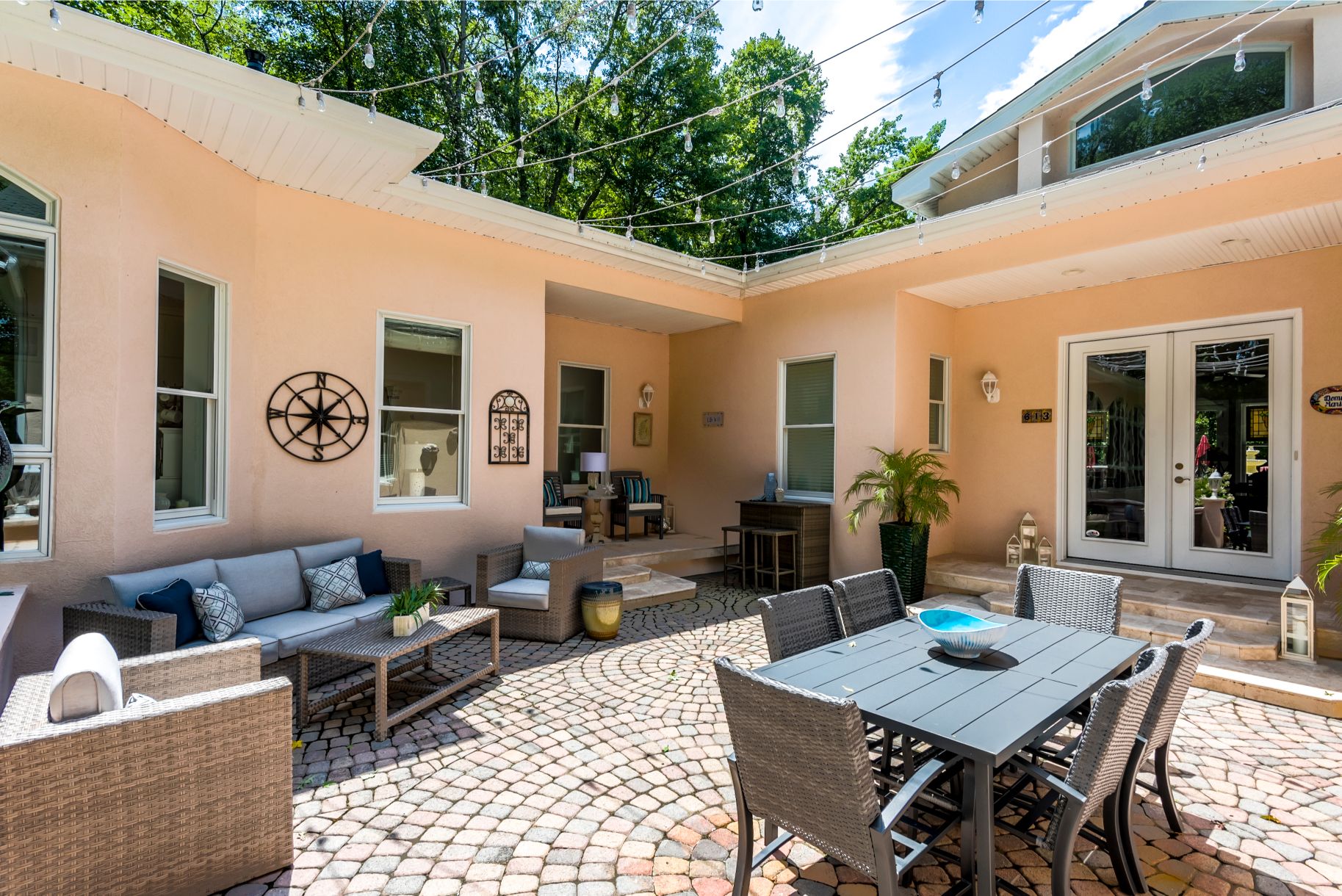 Addition in Juniper Court, Ocean Pines MD - Patio Area with Rattan Furniture and Round Paving
