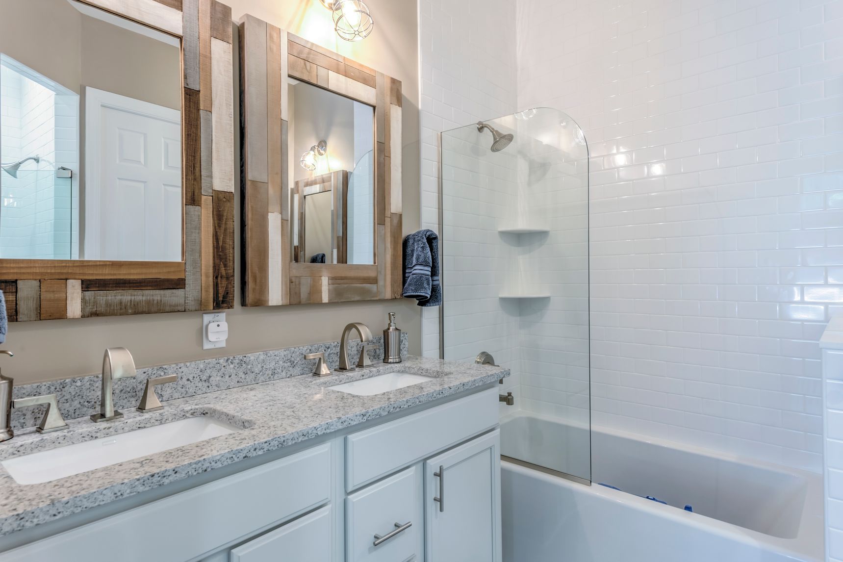 Bathroom in Juniper Court, Ocean Pines MD with Dual Sink and Two Square Mirrors with Mosaic Frames