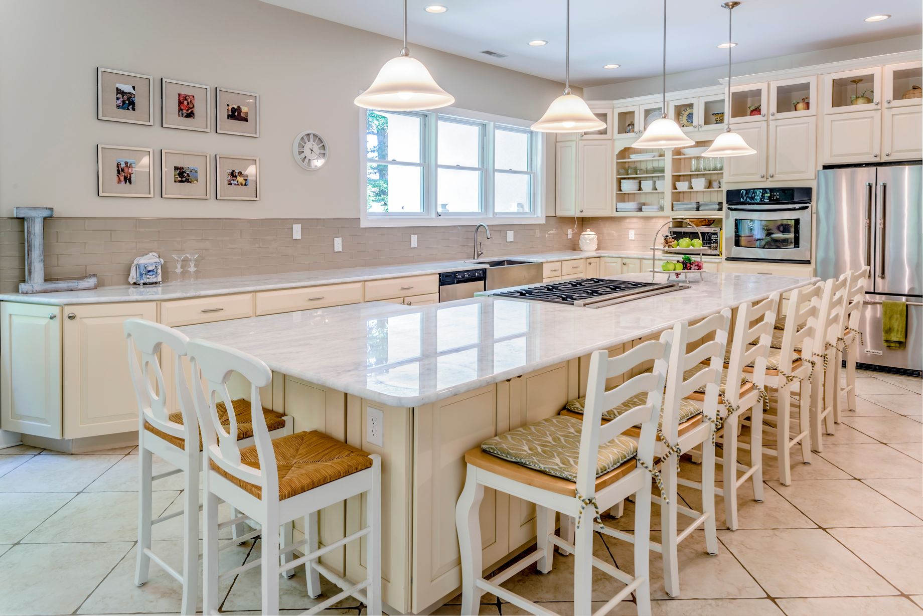 Kitchen in Juniper Court, Ocean Pines MD with Island with White Marble Countertop and White Tiles Flooring