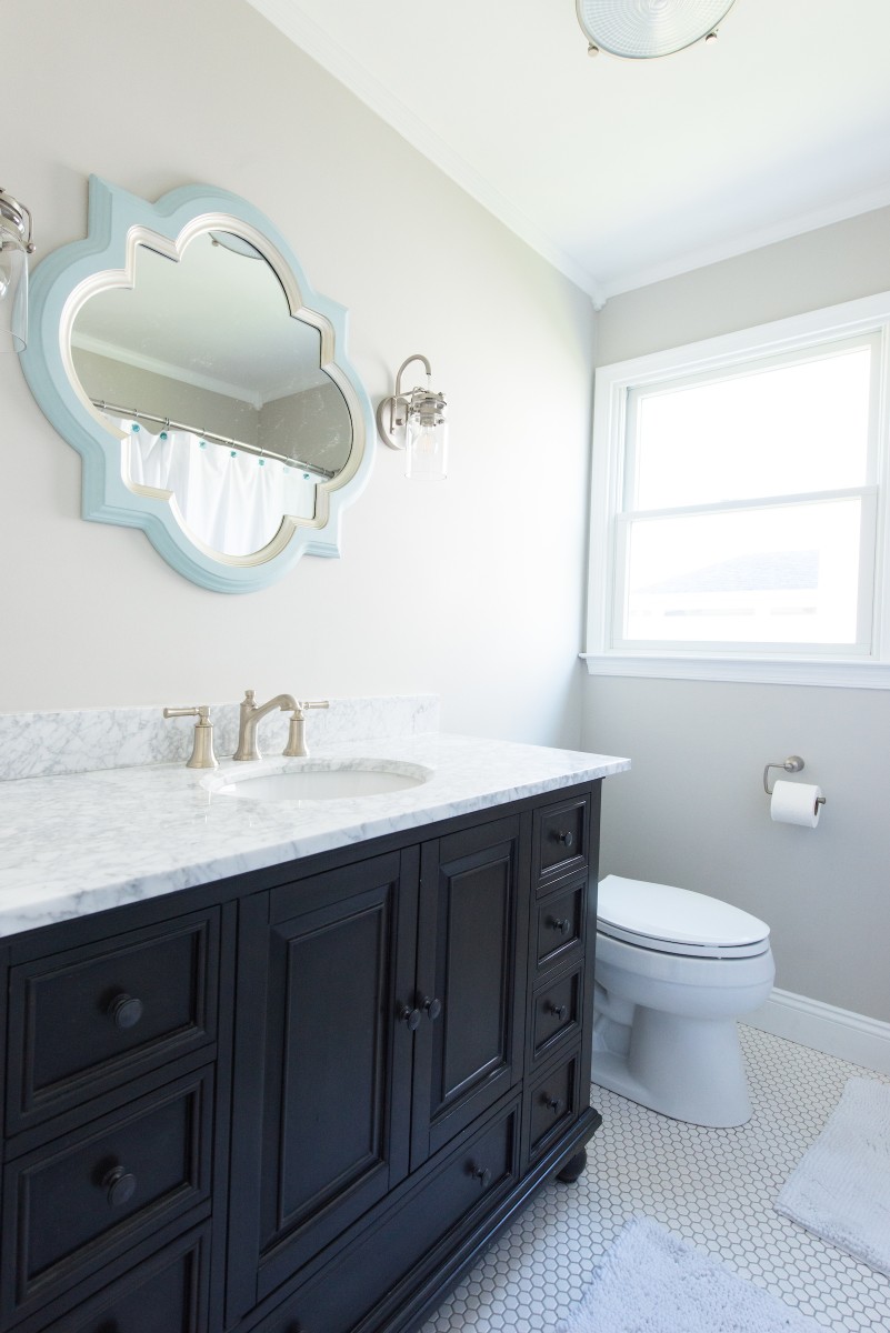 Kent Renovation Guest Bathroom with Dark Wood Vanity, Shadow Storm Granite Top, Ornament Mirror, Honeycomb White Floor Tiles