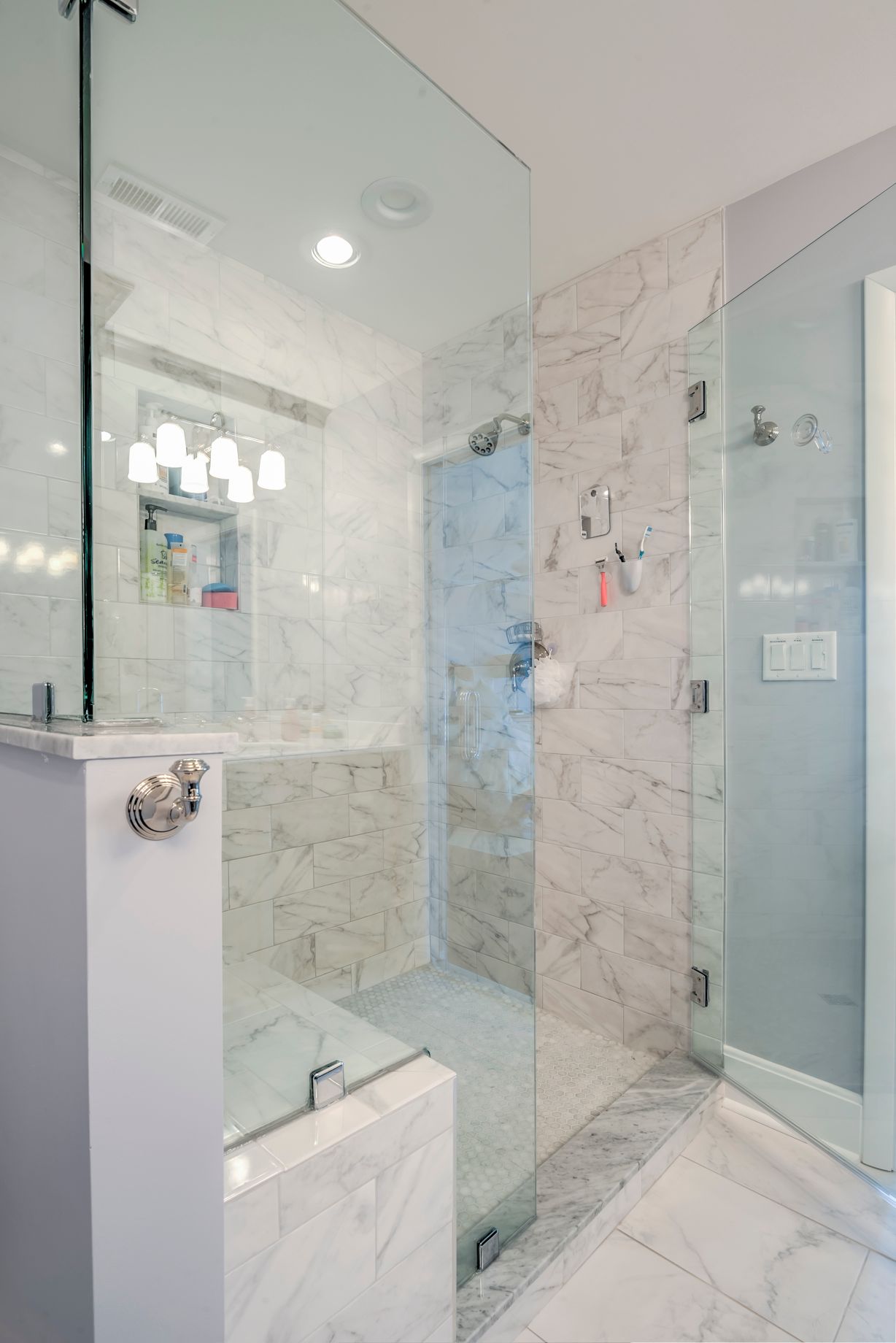 Bathroom Remodel in Kings Grant, Fenwick Island DE with Marble Floor and Shower Wall Tiles, and Frameless Shower Door