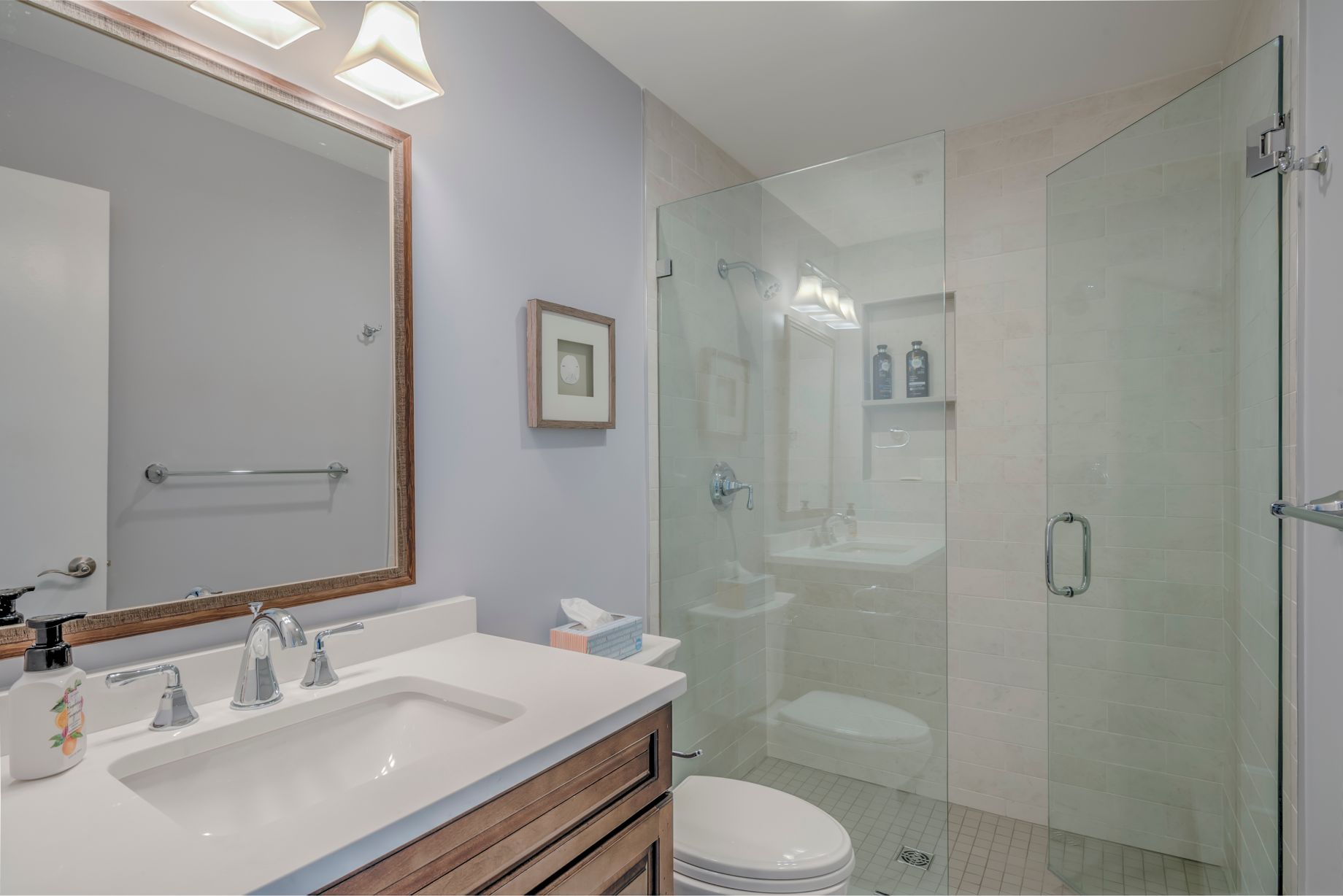 Bathroom Remodel in Kings Grant, Fenwick Island DE with Light Wood Vanity with White Top, and Large Square Mirror