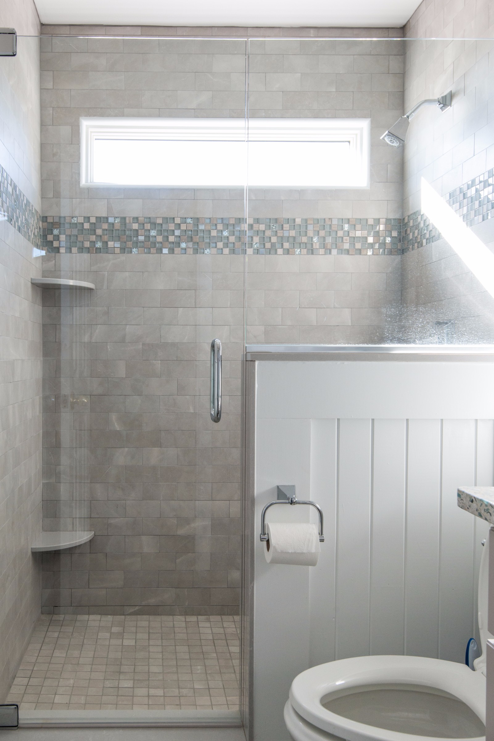 Bathroom Remodel in Kings Grant, Fenwick Island DE with Frameless Glass Door, Nordic Grey Corner Shelves and Square Floor Tiles