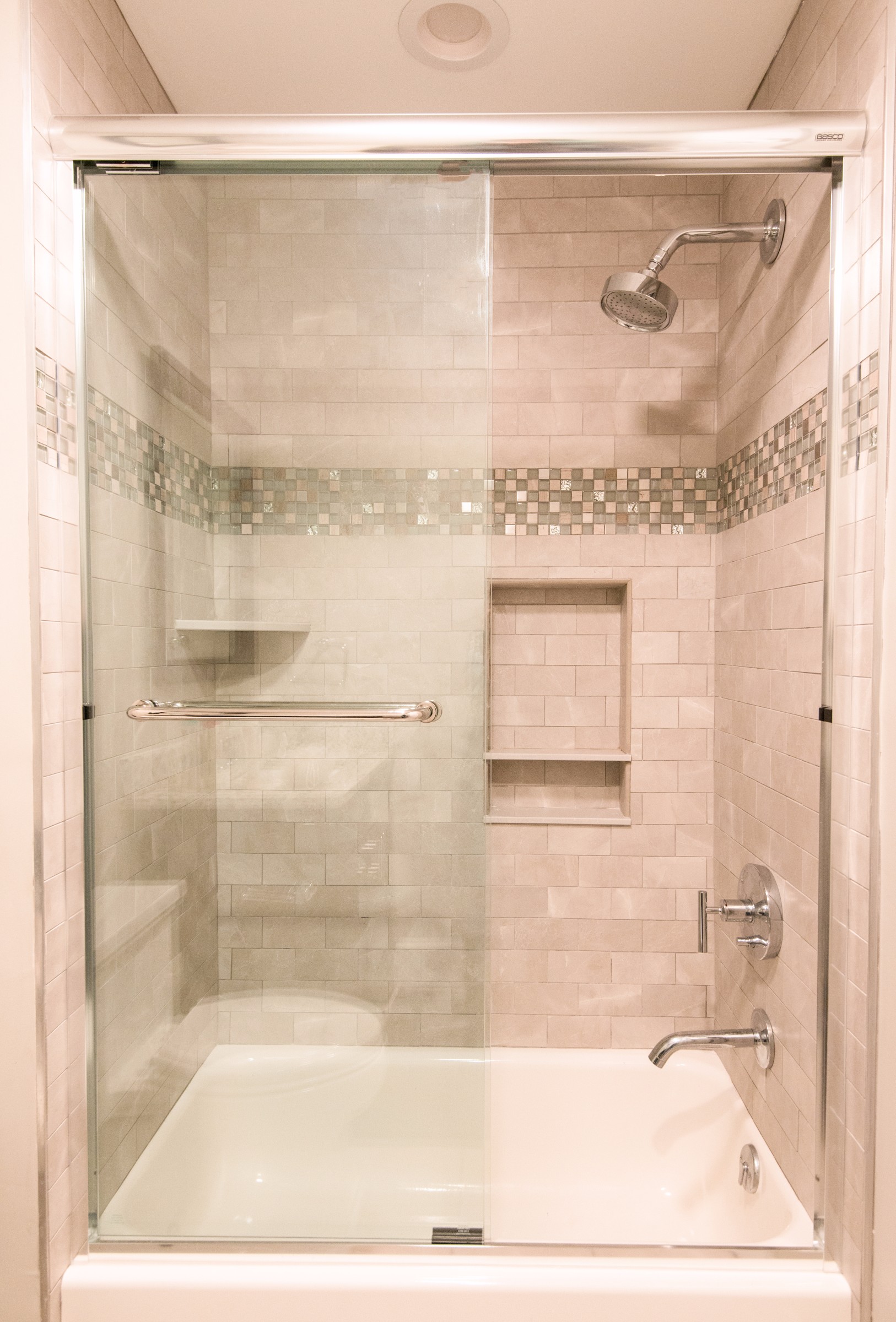 Bathroom Remodel in Kings Grant, Fenwick Island DE with Frameless Sliding Glass Door and Nordic Grey Subway Wall Tiles