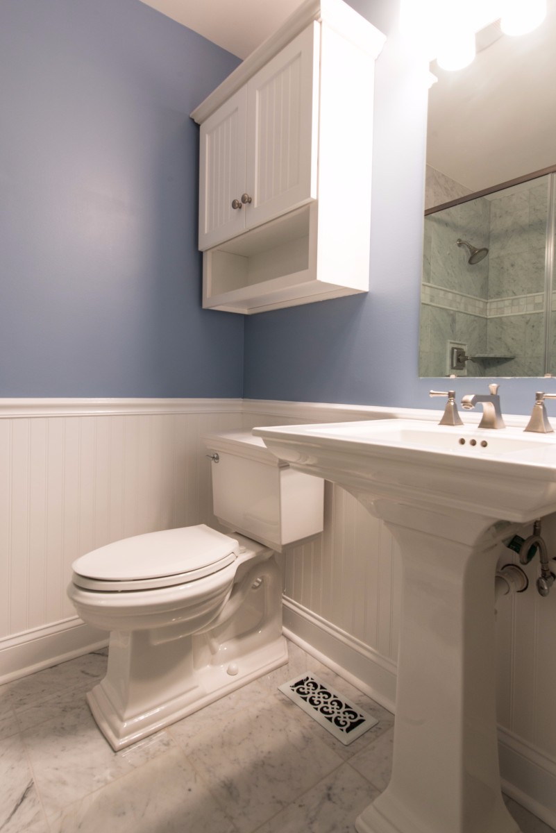 Bathroom Remodel in Ocean Ridge, Bethany Beach DE with Memoirs Pedestal Sink, Elongated Toilet, Mirror and White Cabinet