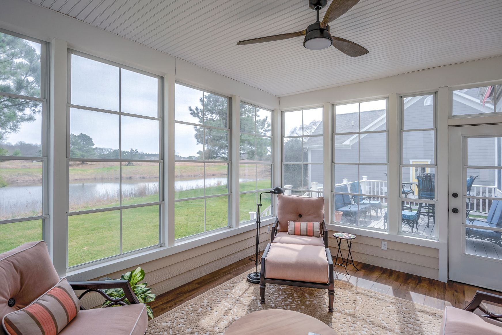 October Glory Exterior in Ocean View DE - Sunroom with View of Landscape and Lower Deck