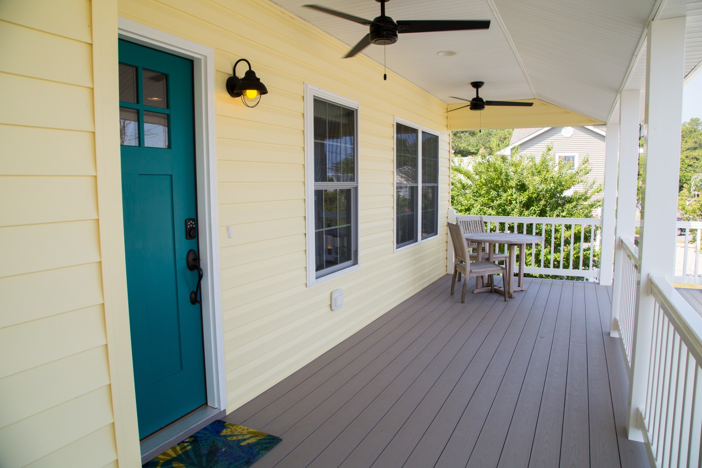 Porch with Main Entrance, Ceiling Fans and Beige Flooring