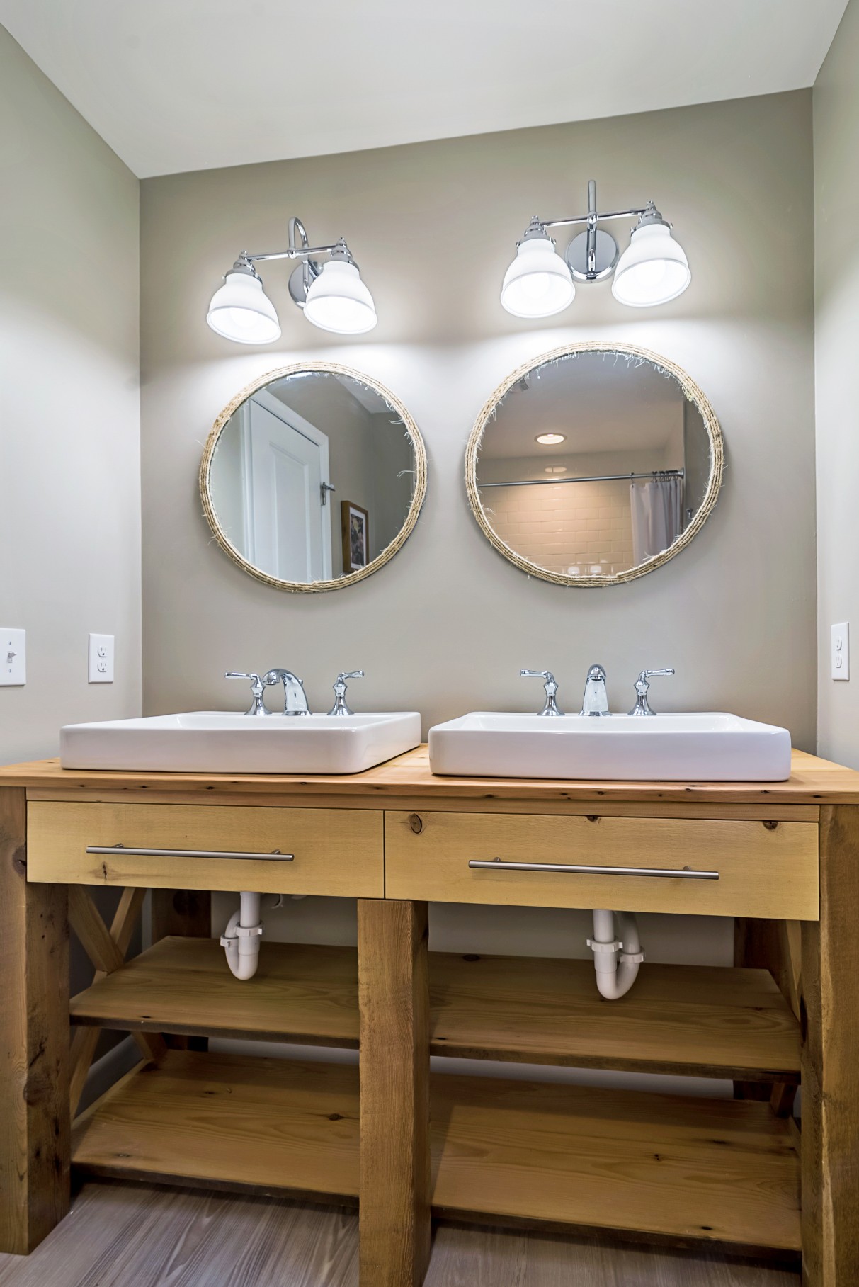 Bathroom Remodel in Wellington Parkway, Bethany Beach DE with Two Sinks, Chrome Faucets and Dual Double Lighting