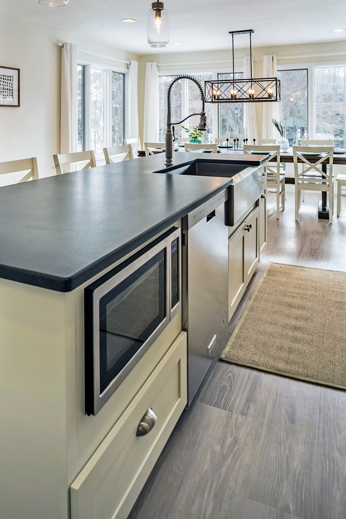 White Center Island with Black Countertop in Wellington Parkway, Bethany Beach DE Renovation