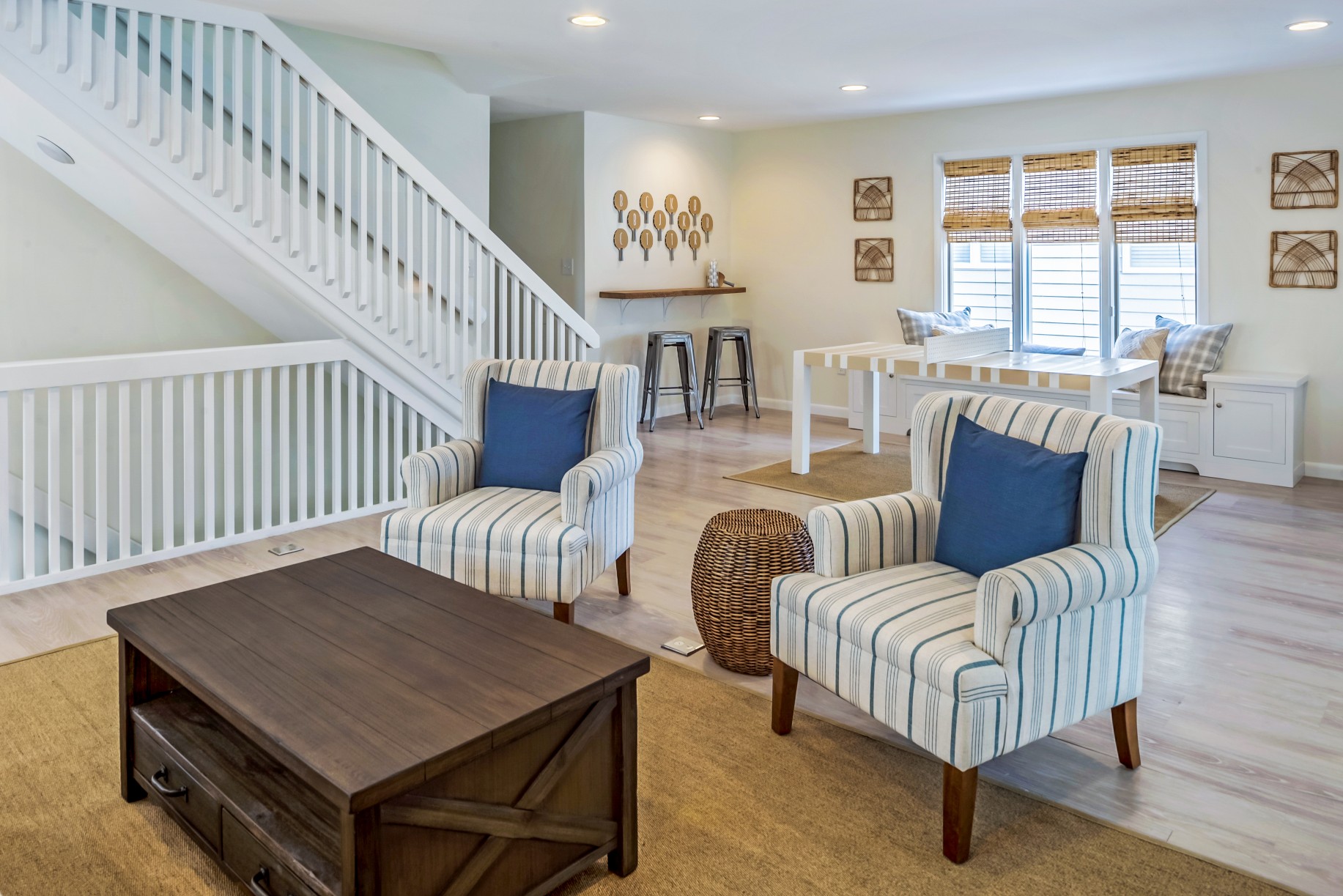 Family Room with Dark Wood Table and Two Armchairs in Wellington Parkway, Bethany Beach DE Renovation