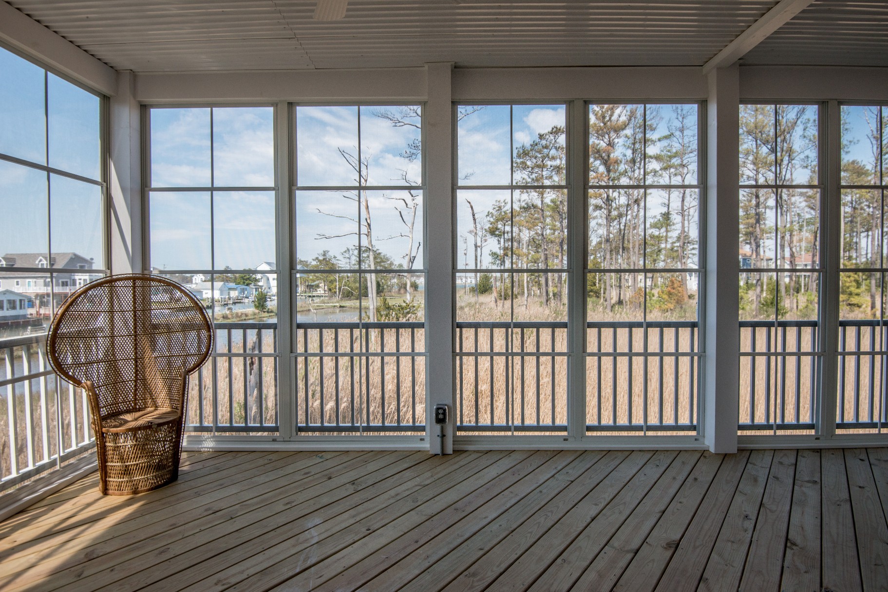 Whitesview Court Sunroom in Ocean View DE with White Front Railing, Wood Flooring and Electric System Power Outlets