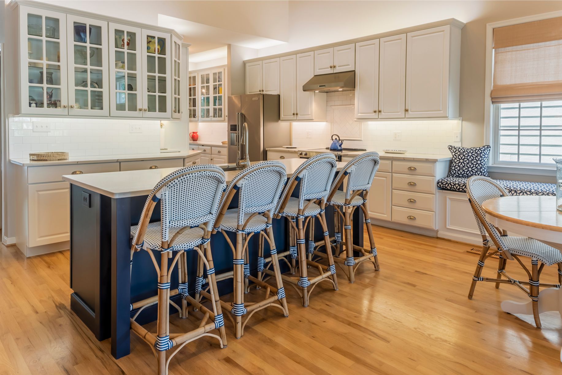 Kitchen Remodel in Willow Oak, Ocean View DE with Four Stools and Navy Blue Center Island Cabinets